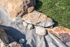 some rocks are laying on the ground next to each other