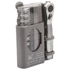 a close up of a lighter with two different tools on it's side,