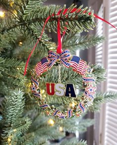 an ornament hanging from a christmas tree with the word usa written on it