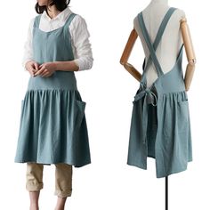 a mannequin wearing an apron and overalls standing in front of a white background