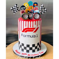 a birthday cake with racing themed decorations on it's top and the name formula 1