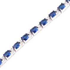 Intricately designed womens bracelet in gold or silver with created blue sapphire stones that offers a sophisticated look Design with environmentally friendly copper and AAA+ cubic zirconia Bracelet can accommodate wrists from 6.5 in to 7.5 in. The additional 1 inch link comes installed but can be easily removed This womens bracelet is part of our signature gift collection and is packaged with a luxury velvet jewelry box This is the perfect gift for wife, girlfriend, mother, daughter and more Gi Sapphire Cubic Zirconia Tennis Bracelet With Gemstone, Sapphire Cubic Zirconia Bracelets, Sapphire Cubic Zirconia Tennis Bracelet, Blue Cubic Zirconia Crystal Bracelet, Formal Sapphire Oval Bracelets, Blue Oval Sapphire Diamond Bracelet, Elegant Blue Cubic Zirconia Crystal Bracelet, Formal Sapphire Oval Bracelet, Formal Blue Oval Diamond Bracelet