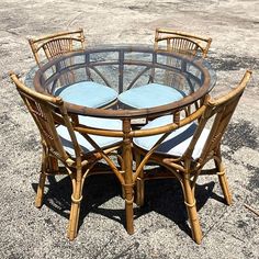 a round table with four chairs around it