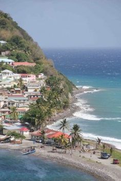 an aerial view of a small town on the coast