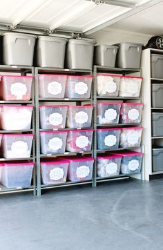 the garage storage and organization is organized with plastic bins