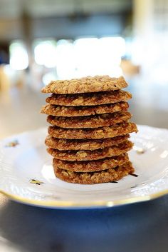 a stack of cookies sitting on top of a white plate