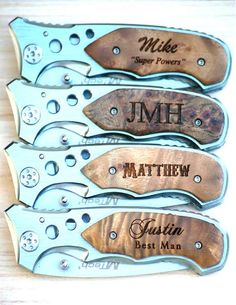 five knives with names on them sitting next to each other