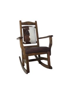 a wooden rocking chair with a cowhide pillow on it's backrest and seat