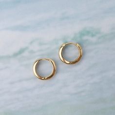 These Small 14k Yellow Gold Huggie Earrings are the perfect basic huggie for any occasion! 14k yellow gold 3mm width 12.5mm Classic Tarnish-resistant Huggie Cartilage Earrings, 14k White Gold Huggie Cartilage Earrings, Classic Hypoallergenic Huggie Hoop Earrings, Minimalist 14k Gold Hoop Earrings With Shiny Finish, 14k Yellow Gold Round Hoop Earrings, Classic Huggie Earrings As Gift, Classic Huggie Cartilage Earrings For Anniversary, Everyday Hypoallergenic Yellow Gold Huggie Earrings, Classic Everyday Hypoallergenic Huggie Earrings