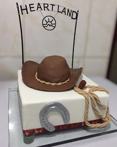 a cake made to look like a cowboy's hat on top of a white box