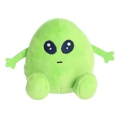 a green stuffed animal with big eyes