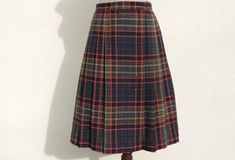 "Beautiful vintage wool and polyester blend plaid wrap kilt skirt by Pea Pod. Closes with two buttons on the waistband and an oversize gold safety pin. Unlined. Size tag says 9, but go by waist measurement for fit. Shown on a size 6 US dress form, unpinned, a nice fit at the waist. Clean, no holes, no flaws found. Excellent condition! Garment Measurements, taken on the outside, with item flat, edge-to-edge, double for circumference: Waist: 14\" Length: 26-1/2\" US Size 6 Dress form in pictures m Plaid Wrap Skirt, Kilt Skirt, Waist Measurement, Beautiful Sweater, Plaid Fashion, 50s Fashion, Wool Skirts, Dress Form, Wool Cardigan