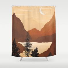 a shower curtain with mountains and trees on it