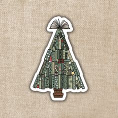 a christmas tree sticker on a burlap background