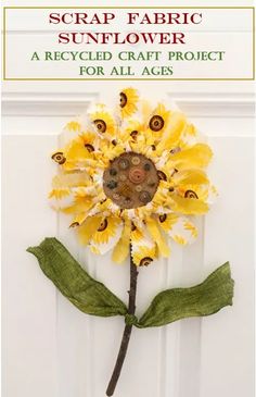 a sunflower made out of scrap fabric on a white door with text overlay that reads scrap fabric sunflower recycled craft project for all ages