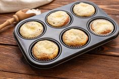 muffins in a baking pan on a wooden table