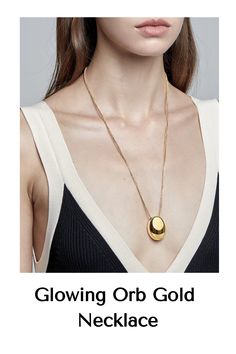 Meet your new go-to piece, the Glowing Orb Necklace. With its sleek gold chain and bold, polished orb pendant, this necklace brings a modern edge to any look. Perfect for layering or wearing solo, it effortlessly transitions from day to night. Add a touch of chic simplicity to your style and let this standout piece do the talking. Chain Material: Solid 18 karat yellow gold rolo chainPendant Material: Titanium steel with 18 karat gold finish Hypoallergenic, waterproof. Modern Gold Necklaces With Detachable Pendant, Modern Gold Necklace With Detachable Pendant, Modern Gold Necklace With Oval Pendant, Modern Oval Pendant Necklace With Chain, Modern Gold Chain Necklace With Oval Pendant, Glowing Orb, Orb Necklace, To Night, Gold Finish