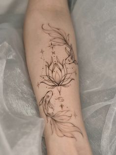 a woman's foot with a tattoo design on the left side of her leg