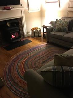 a living room with couches and a fire place