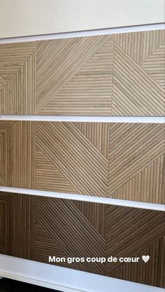 three different types of wood panels on the wall