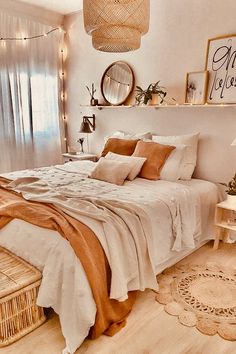 a bedroom with a bed, wicker baskets and pictures on the wall above it