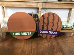 two cardboard circles with the words thin mints and caramel delights on them