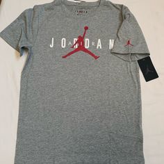 Nike Air Jordan Boy's T-Shirt . Brand New With Tag . Boy's Size : Xl (13-15 Yrs) Color : Dark Grey Heather . Short Sleeve Tee With Graphic . 60%Cotton 40% Polyester Heather Cotton Streetwear Top, Heather Cotton Top For Streetwear, Dark Heather Cotton Crew Neck Top, Casual Dark Heather Short Sleeve T-shirt, Heather Crew Neck Top With Graphic Print, Casual Heather Sports Tops, Dark Heather Short Sleeve Casual T-shirt, Casual Dark Heather Crew Neck T-shirt, Casual Athletic Heather Cotton T-shirt