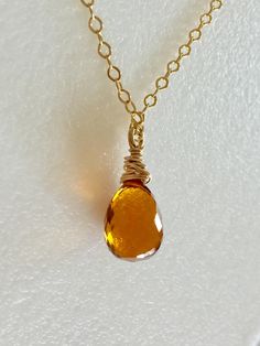 "Sunshine in a bauble! Breathtaking yellow Madeira citrine golden topaz briolette wire wrapped in 14k gold fill on a lovely 14k gold fill cable chain with spring ring clasp. The finest shade of citrine in a lush hydro quartz teardrop. Faceted gemstone measures 11 to 12mm. Available in 16\", 18\", and 20\" lengths. Stunning November birthstone!" Yellow Topaz Necklace, Golden Amber, Amber Gemstone, Topaz Necklace, Amber Necklace, November Birthstone, Hippie Jewelry, Topaz Gemstone, Faceted Gemstones