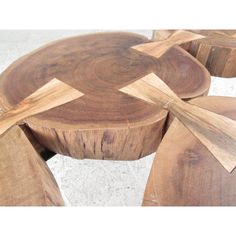 several pieces of wood are arranged in the shape of an x on top of each other