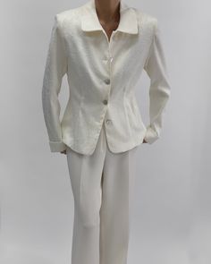 Classic and elegant Hennes Collection vintage blazer in cream-white. Features long sleeves, front buttons, no pockets. Flower pattern with padded shoulders from 2000s. In excellent vintage condition. Material: Outer- 55% polyester, 42% cotton, 3% elastaan/ Lining- 100% acetate Recommed Fit: M - see measurments.    Size Tag Reads: 42 Measurments Laid Flat: Length: 63cm, 24,8" Chest: 100cm, 39,3" Sleeve: 63cm, 24,8" Styled on 5.7 ft (172 cm), usually dressed in size S. Please know all pieces are v Classic Cream Single-breasted Blazer, Classic Cream Blazer With Button Closure, Classic Cream Blazer With Button Cuffs, Classic White Blazer, Semi-formal White Outerwear With Buttons, White Semi-formal Outerwear With Buttons, Elegant Single-breasted Long Sleeve Blazer, Elegant Long Sleeve Single Breasted Blazer, Classic Formal Blazer With Covered Buttons