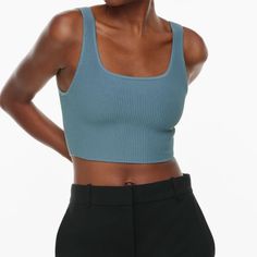 An Everyday Luxury Essential Loved For Its Universally Flattering Fit, This Is A Cropped Tank With A Double Square Neckline And Fully Fashioned Construction. It’s Made With Sculpt Knit Our Signature Figure-Enhancing Yarn. This Compressive, All-Season Fabric Holds You In All The Right Places To Shape And Sculpt Your Form. Like Nothing Else. This Version Is Constructed Using An Ottoman Stitch With Close Distinct Ribs For A Structured And Textural Feel. Features Fully Fashioned Construction Means Y Chic Stretch Blue Knit Top, Chic Blue Ribbed Top, Trendy Blue Seamless Top, Blue Casual Crop Top With Seamless Construction, Fitted Light Blue Knit Top, Light Blue Fitted Knit Top, Chic Blue Seamless Crop Top, Fitted Ribbed Blue Knit Top, Fitted Blue Ribbed Knit Top