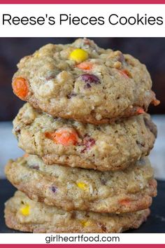 reese's pieces cookies stacked on top of each other with candy corn in the middle