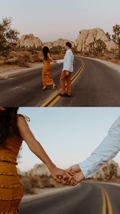 two people holding hands and walking down the road in front of some rocks, with one person wearing an orange dress