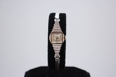 This is an amazing women's art deco; vintage made 1930-1940s Benrus 14k solid white gold with natural diamond mechanical, hand-winding watch. The watch works and keeps time well. Movement has been fully serviced.  The watch requires no battery, it is operated on wind up mechanism! It is ready to be worn. Art Deco Gold Watches For Evening, Art Deco Gold Jewelry With Diamond Hour Markers, Yellow Gold Art Deco Evening Watches, Art Deco Yellow Gold Evening Watches, Gold Art Deco Evening Watch, Collectible Timeless Jewelry With Diamond Hour Markers, Art Deco White Gold Diamond Watch, Elegant 14k Gold Watches For Evening, Elegant 14k Gold Evening Watches