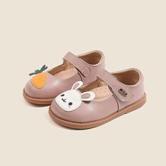 Introducing our Cartoon Rabbit Leather Flat Shoes – the perfect blend of comfort, style, and whimsical charm. Crafted with your little one's comfort in mind, these flat shoes are made from high-quality leather that's gentle on their delicate feet. The star of the show is our adorable cartoon rabbit or carrot design, adding a playful touch to your child's footwear collection. The strap ensures a secure fit, so your little explorer can hop and skip with ease while wearing these delightful shoes. W Spring Flat Leather Shoes With Soft Sole, Cute Flat Heel Mary Janes For Spring, Cute Spring Mary Janes With Round Toe, Spring Cute Mary Janes With Round Toe, Cute Mary Janes With Round Toe For Spring, Cute Spring Mary Janes With Closed Toe, Spring Leather Shoes With Soft Sole And Flat Heel, Cute Mary Janes With Rubber Sole And Round Toe, Cute Pink Mary Janes For Spring