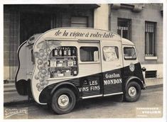 an old black and white photo of a food truck