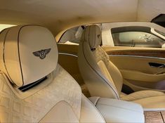 the interior of a luxury car is clean and ready for customers to ride in it