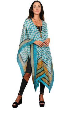 Our best seller know as our “Poncho” is a very easy to wear shape. It has open sides, a neckline in the center is the ESSENTIAL Travel Must have item! The poncho can be worn many ways such as shown; as a scarf, wrap around your hip as a sarong, one shoulder over a dress, and has many multi functions (see chart of many ways to wear). It’s the must have beach cover up and also looks great over jeans. We suggest you wear it on the plane to keep warm while traveling and this way you are sure you hav Beach Cape Shawl For Fall, One Size Wrap Kaftan, One Size Shawl Poncho For Vacation, Beach Poncho In One Size, Fall Beach Cape Shawl, One Size Bohemian Shawl Cape, Chic Beach Cover-up Poncho, Bohemian One Size Shawl Cape, Casual Poncho With Kimono Sleeves