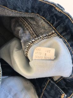 "Waist:26\" Rise:10.5\" Hips:32\" Inseam:6\" These are USA made Movin' On Levis zip fly cutoffs circa the late 70's or early 80's. They're tagged a vintage 28\" but fit a modern 26\" at largest. Please follow the measurements provided above and in the photos for an accurate fit as true vintage runs small and narrow. They're cut to the perfect unisex length and have amazing details on the pockets and feature a rare blue tab. 🍑(5)" Vintage Jeans With Frayed Hem For Spring, Spring Vintage Jeans With Frayed Hem, Retro Dark Wash Jean Shorts For Spring, Retro Straight Leg Jean Shorts With Pockets, Vintage Straight Leg Cotton Shorts, Vintage Cotton Straight Leg Shorts, Retro Spring Jean Shorts With Frayed Hem, Vintage Dark Wash Denim Shorts, Dark Wash Distressed Straight Leg Jean Shorts