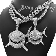 6ix9ine Silver PT Iced Shark Pendant & 18" Iced Cuban & 1 Row Chain Necklace HIP HOP CELEBRITY STYLE BRAND NEW USA SELLER Product Description Large Pendant & Chain : Pendant Size : 70mm x 60mm Chain Size : 12mm 18" COLOR: White Gold Plated Lab Simulated Diamonds Box Lock Small Pendant & Chain : Pendant Size : 50mm x 40mm Chain Size : 4.5mm 18" 1 Row Tennis Chain COLOR: White Gold Plated High Quality and polished. Payments: US Customers: Paypal accepted International Customers: Paypal accepted Sh Shark Pendant, Diamond Box, Chicano Drawings, Tennis Chain, Jewelry Lookbook, Usa News, Small Pendant, Chain Pendant, Fashion Jewelry Necklaces