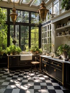 the kitchen is decorated in black and white checkerboard flooring with gold accents