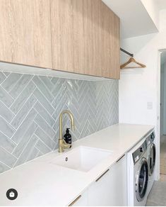 an image of a laundry room with washer and dryer