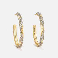 Indulge in luxury with these stunning large hoop earrings, where dazzling diamonds accentuate the octahedron relief design, creating an elegant and captivating allure. For custom requests, please contact us: custom@aetherdiamonds.com. Product Details: 100% recycled 18k gold Diamonds are made from 100% captured carbon B Corp Certified Style Number: E5016 Luxury Hoop Earrings With Pave Setting, Luxury Pave Set Hoop Earrings, Luxury Hoop Earrings With Pave Setting For Wedding, Luxury Pave Set Hoop Earrings For Wedding, Luxury Wedding Hoop Earrings With Pave Setting, Luxury Hoop Earrings With Brilliant Cut, Luxury Hoop Diamond Earrings With Diamond Cut, Luxury Diamond Cut Hoop Earrings In Diamond White, Luxury Diamond Cut White Hoop Earrings