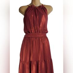 This Dress So Gorgeous. It Is A Beautiful Wine Red Color With A Slight Shimmer. Open Tie Back Closer For A Little Neck Line Peek. Has A Removable Waist Tie Belt That Can Be Tied With Bow In Front Or Back For A Different Look. Or No Tie At All If Desired (All Shown In Pics). Elastic Singed Waist Line. Tiered Bottom. Slip Like Under Lining. Necklace Not Included Size X-Small Red Sleeveless Halter Dress For Date Night, Chic Sleeveless Maxi Dress For Holiday, Fitted Sleeveless Holiday Maxi Dress, Fitted Sleeveless Maxi Dress For Holiday, Red Halter Neck Sleeveless Sundress, Elegant Sleeveless Maxi Dress For Holiday, Chic Sleeveless Dresses For Holiday, Sleeveless Red Midi Dress For Holiday, Elegant Sleeveless Midi Dress For Holiday