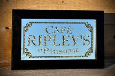 there is a sign that says cafe ripley's of patissee on it