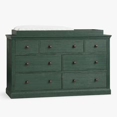 a green dresser with six drawers and a white mattress