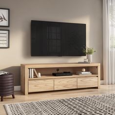 a flat screen tv mounted to the side of a wooden entertainment center in a living room