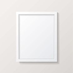 an empty white frame hanging on the wall