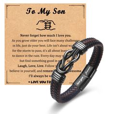 a leather bracelet with an engraved message on the front, and a handwritten note attached to it