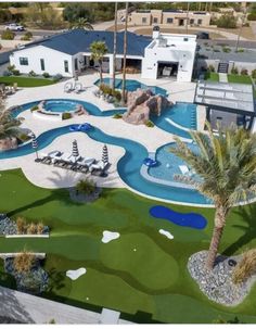 an aerial view of a golf course and pool